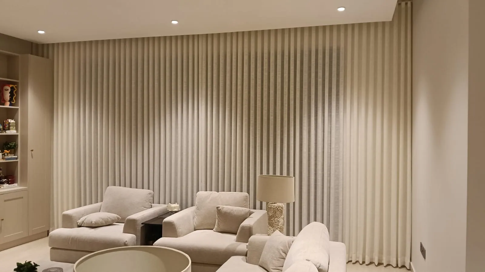 Sheer majlis curtains behind white seating in a Dammam villa